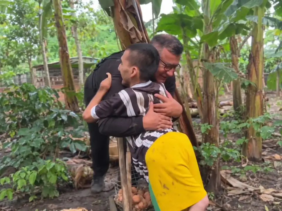 Goyito sharing an embrace with the man who met him in the campaign footage